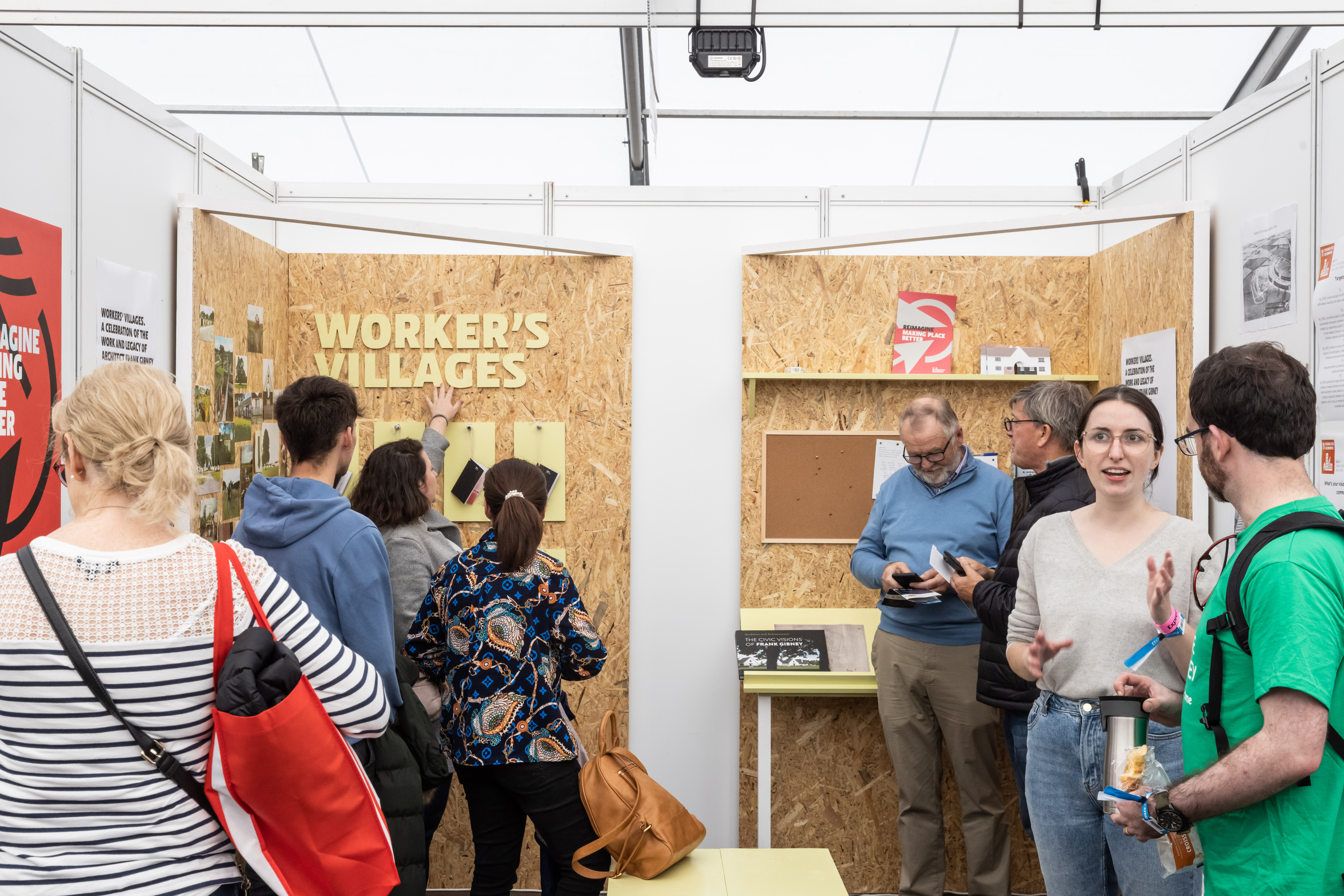 Group of people talking at the the exhibit